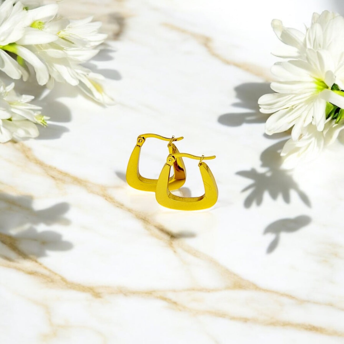 Boucles d’oreilles Copenhague en acier inoxydable doré.
