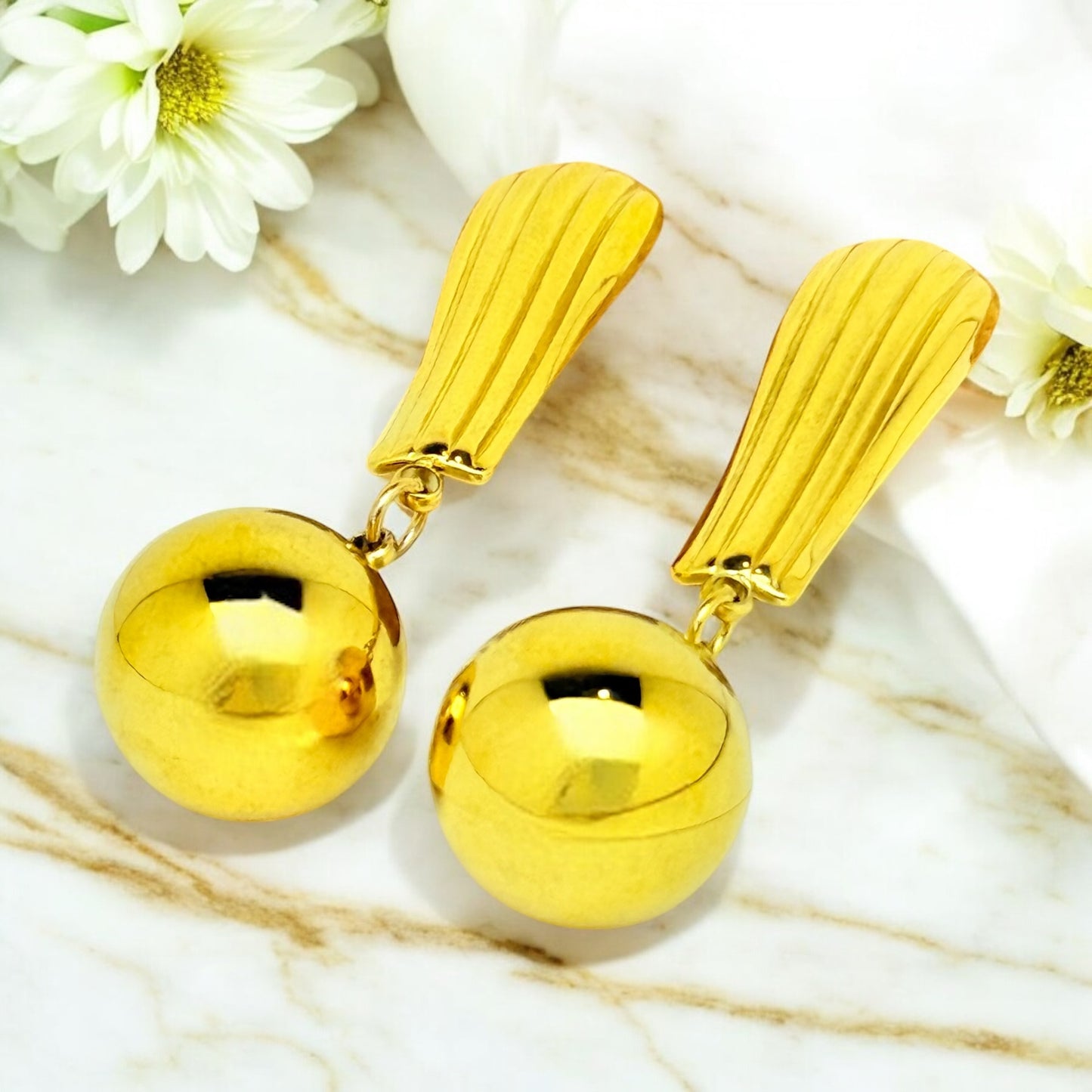 Boucles d’oreilles Harlem en acier inoxydable doré.