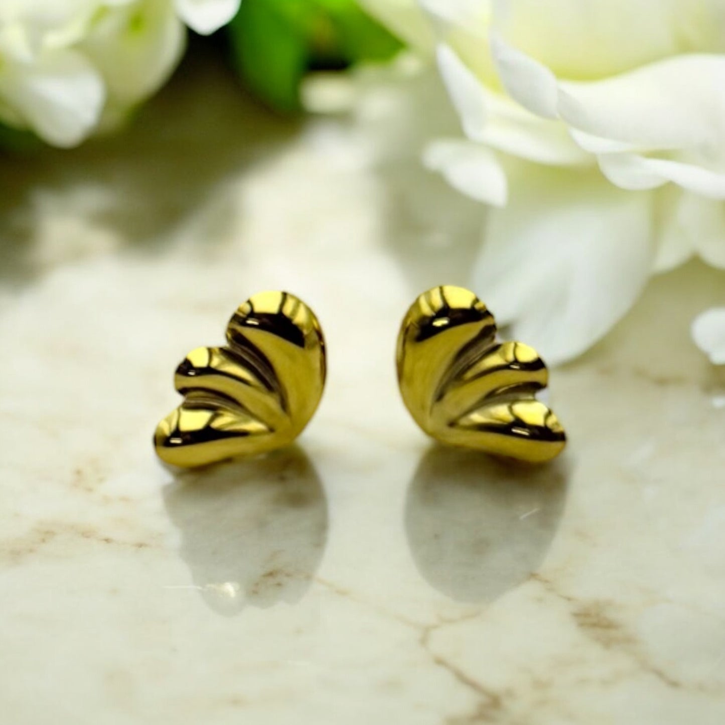 Boucles d’oreilles Ottawa en acier inoxydable doré.